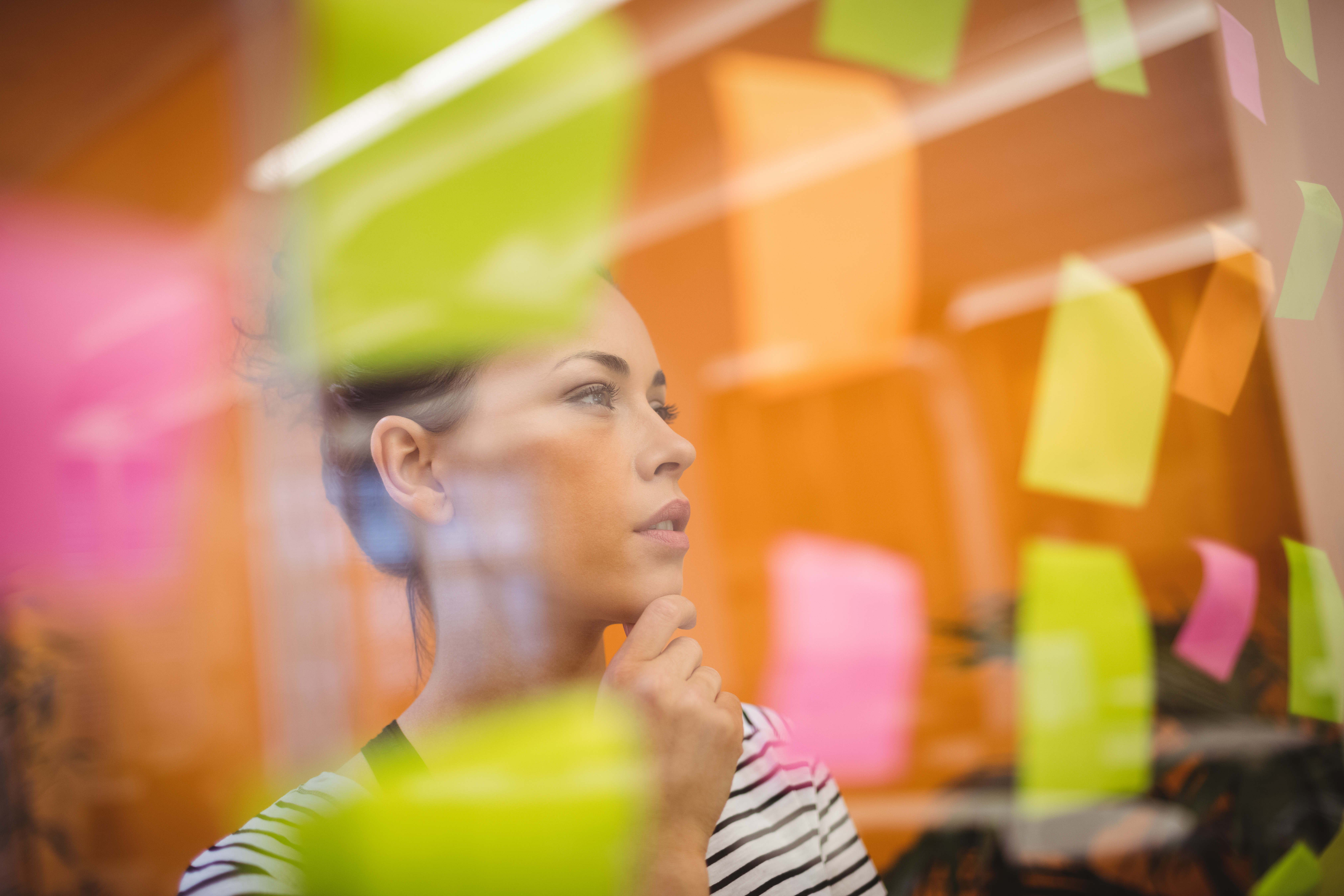 female-executive-reading-sticky-notes